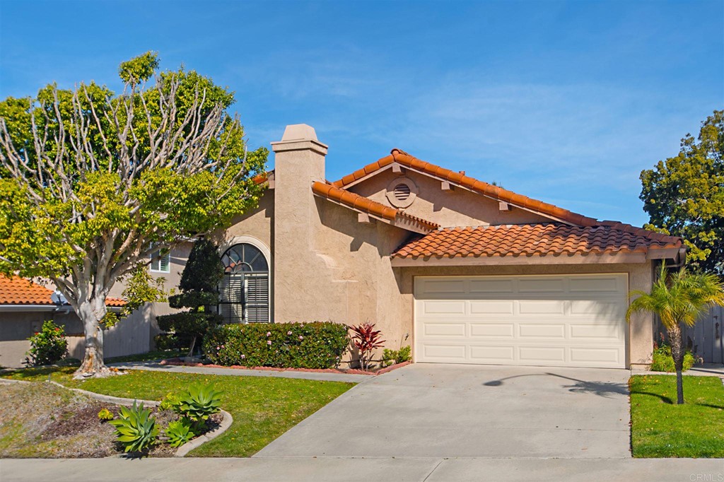 front view of a house with a small yard