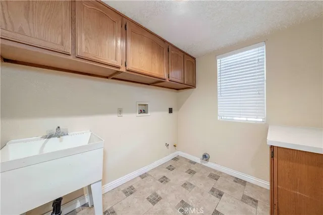 a bathroom with a sink and cabinets