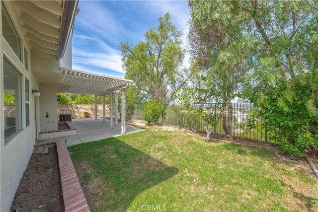 a view of yard with patio