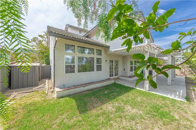 a view of a house with a yard and a garden