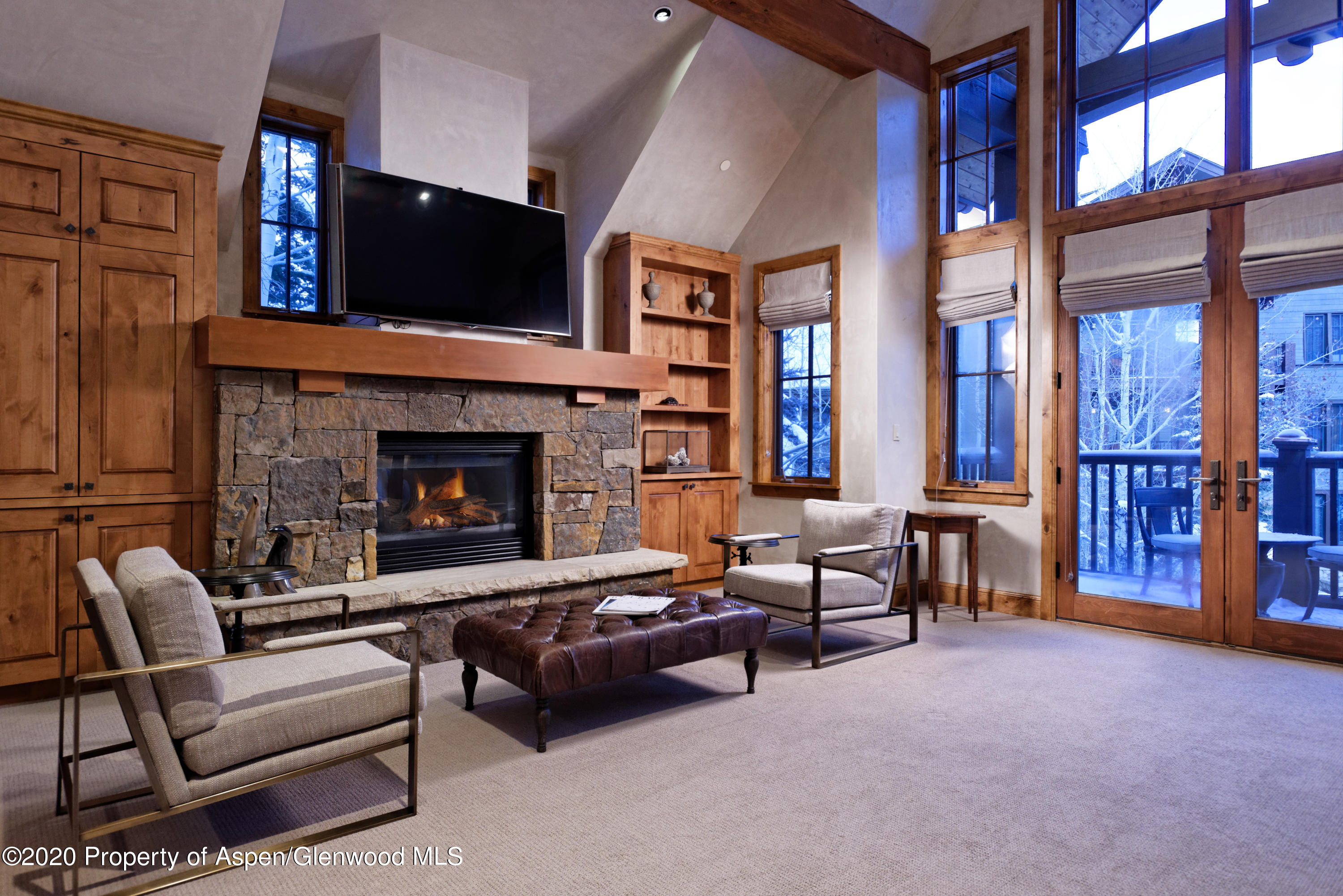 32 Prospector Road Aspen, CO 81611 - Photo 13 of 37 a living room with furniture and a fireplace