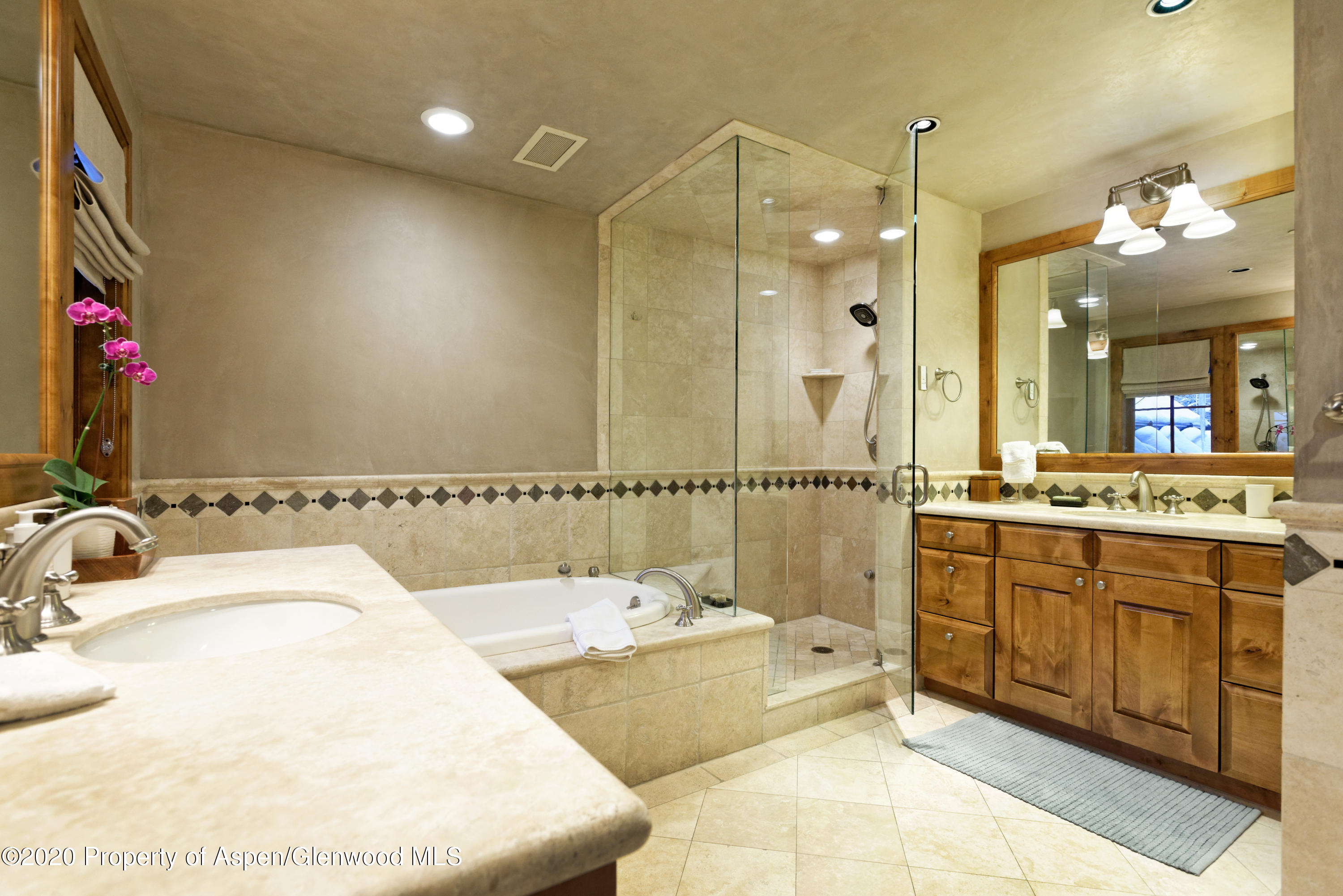 32 Prospector Road Aspen, CO 81611 - Photo 14 of 37 a bathroom with a tub sink and mirror