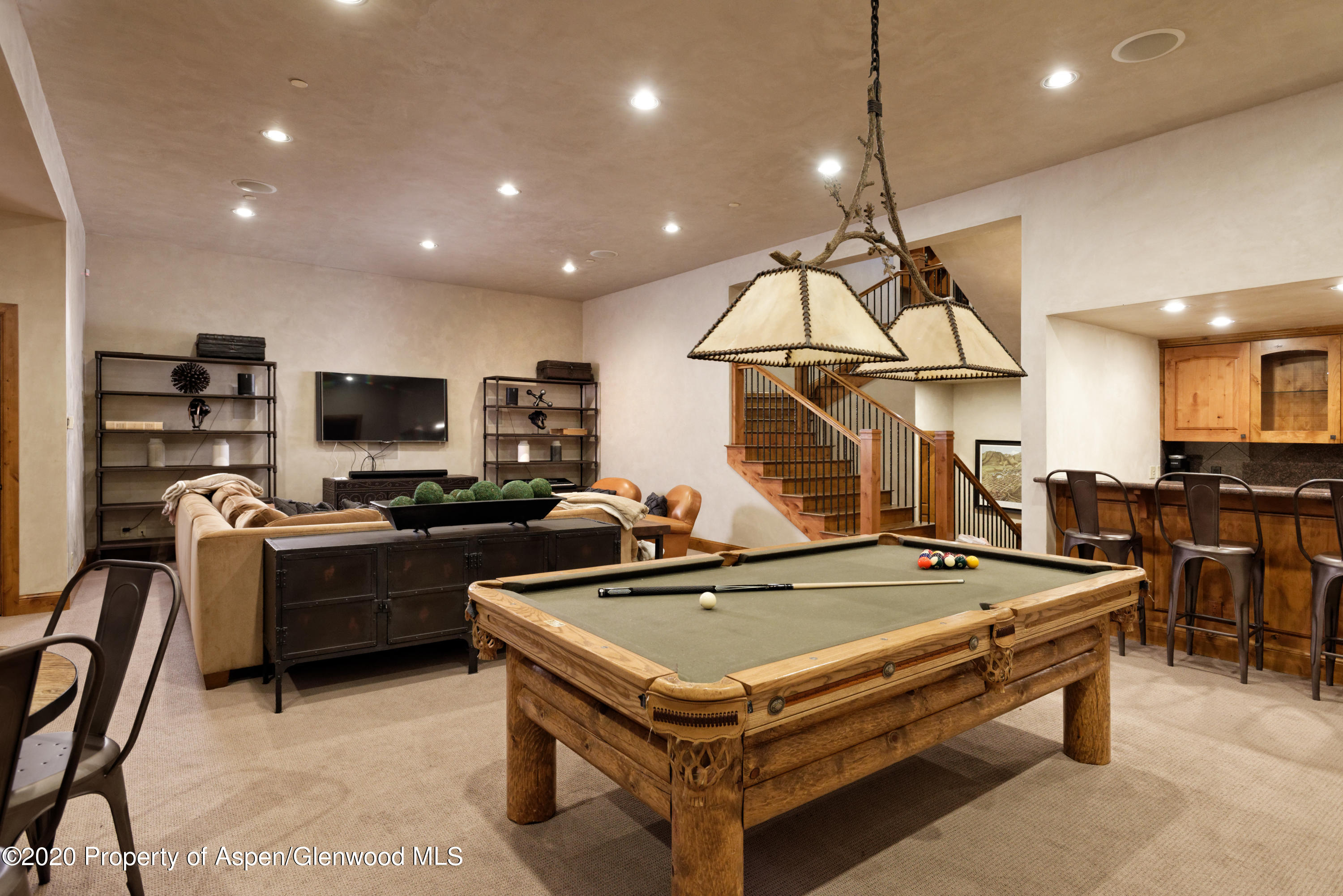 32 Prospector Road Aspen, CO 81611 - Photo 17 of 37 a room with furniture pool table flat screen tv and windows