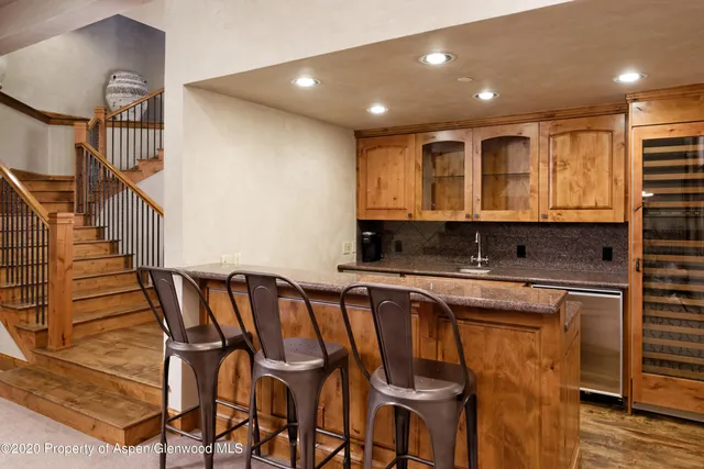 a open kitchen with dining table and chairs