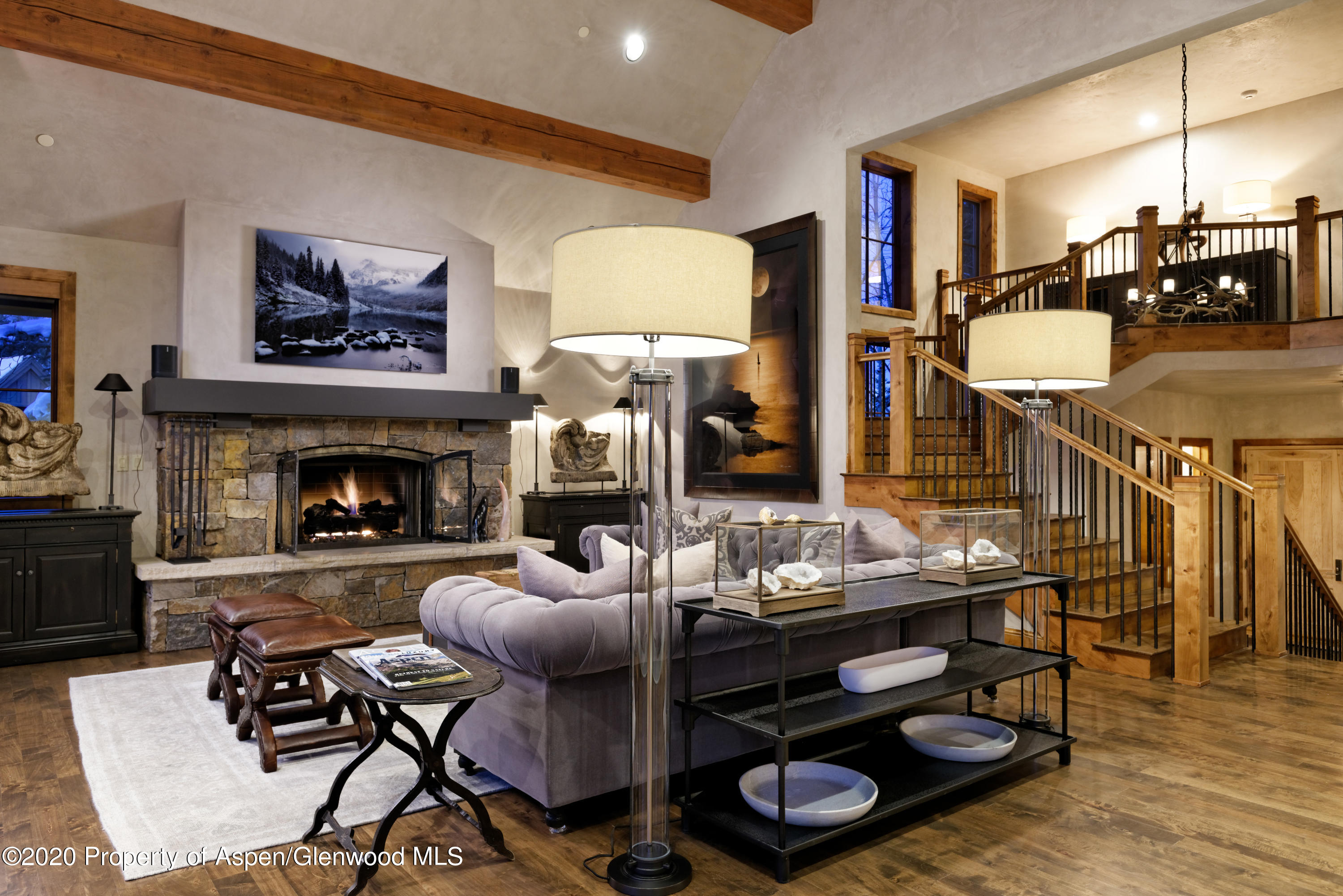 32 Prospector Road Aspen, CO 81611 - Photo 2 of 37 a living room with furniture and a fireplace