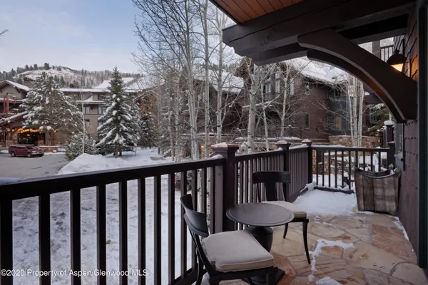 a view of a chairs and table in the patio