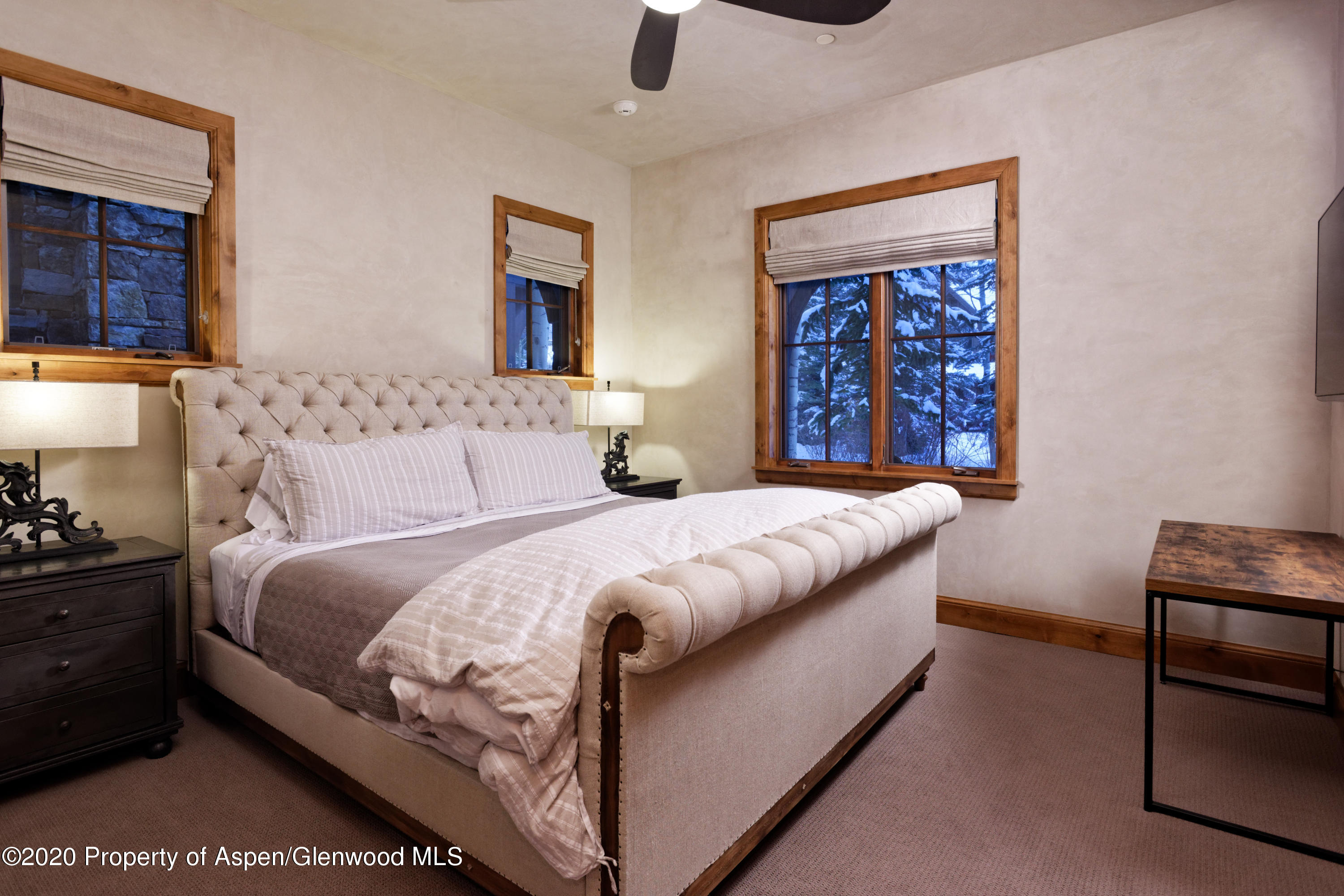 32 Prospector Road Aspen, CO 81611 - Photo 27 of 37 a bedroom with a bed and dresser