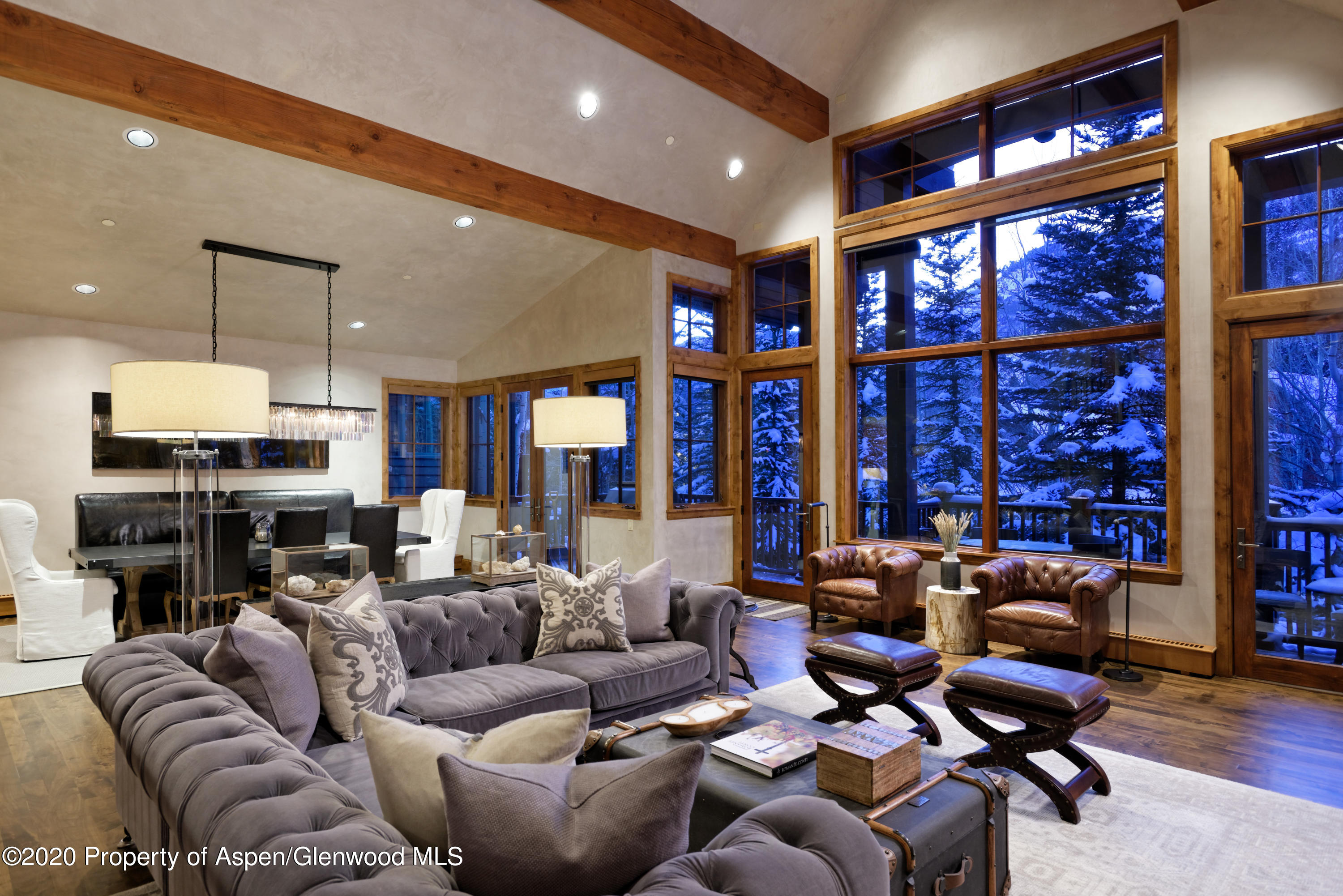 32 Prospector Road Aspen, CO 81611 - Photo 3 of 37 a living room with furniture a large window and gym equipment