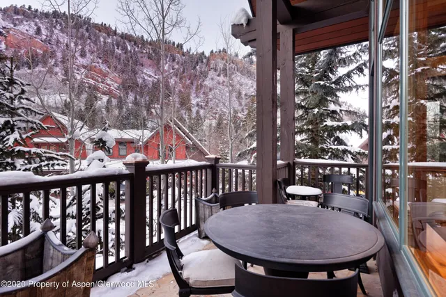 a view of a balcony with chairs