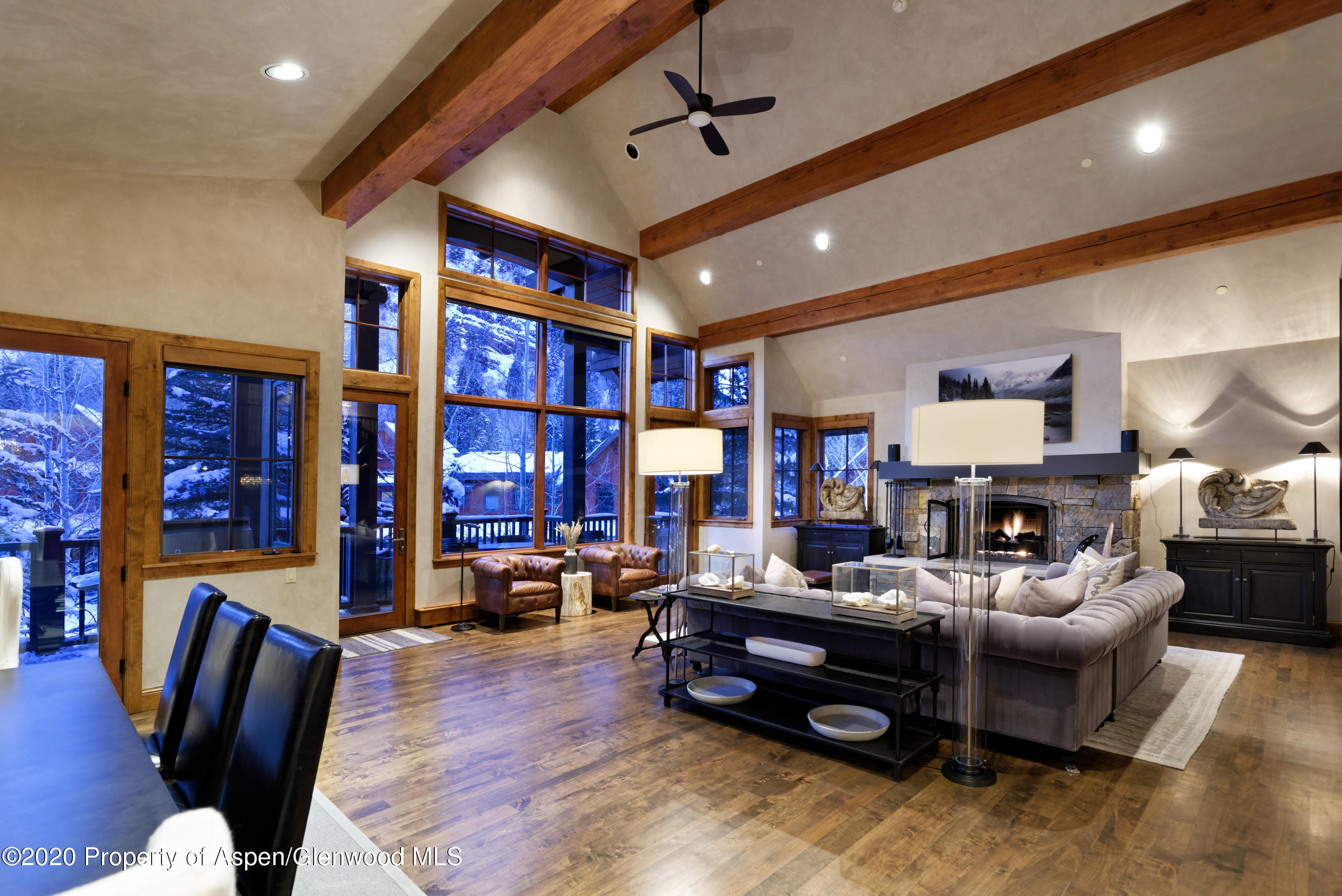 32 Prospector Road Aspen, CO 81611 - Photo 6 of 37 a living room with furniture gym equipment and a large window