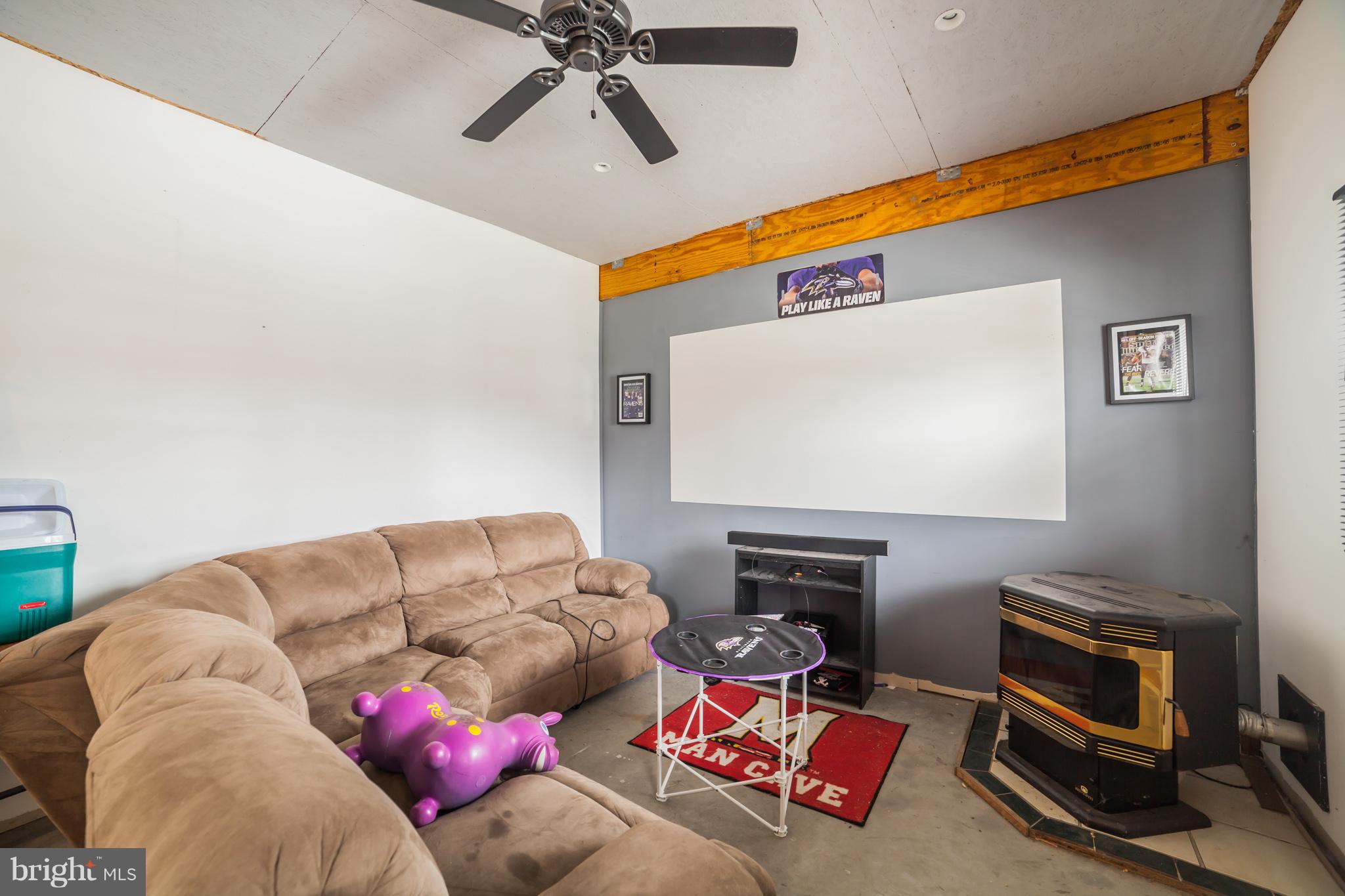 7859 Kentley Road Baltimore, MD 21222 - Photo 36 of 36 Game Room with Pellet Stove and Projection TV