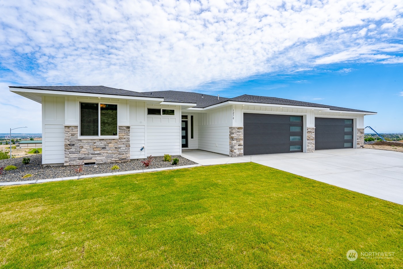 a backyard of a house with yard and outdoor seating