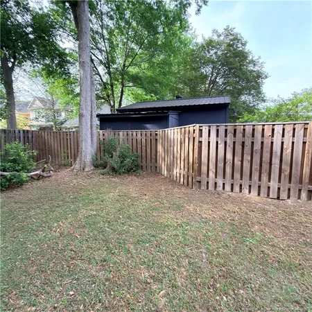 a view of backyard with green space
