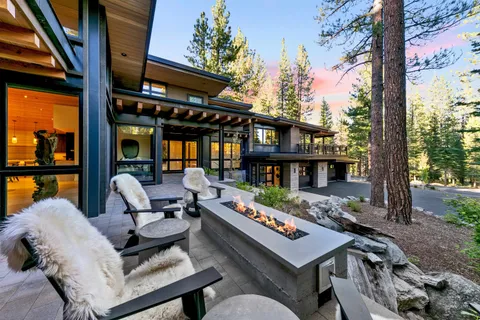 a outdoor living space with furniture and a fireplace