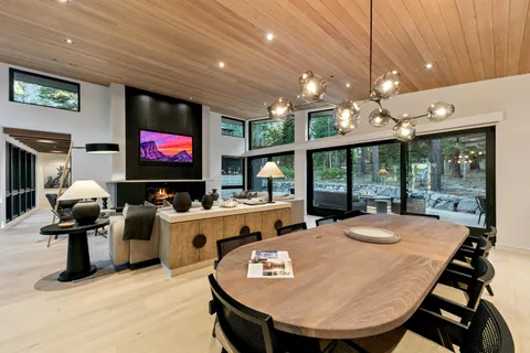 a living room with fireplace furniture and a flat screen tv