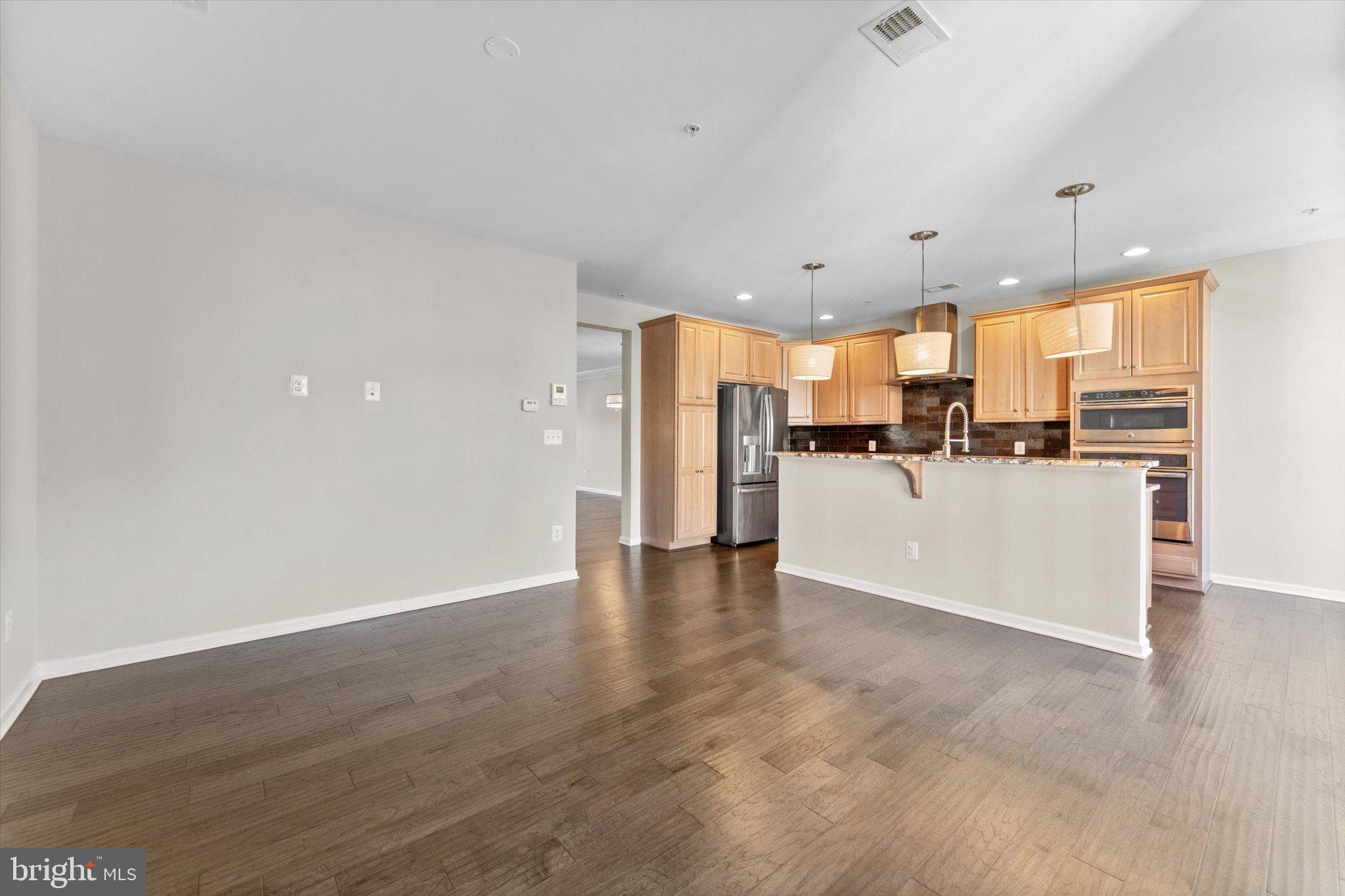23483 Logans Ridge Terrace Ashburn, VA 20148 - Photo 11 of 35 a kitchen with stainless steel appliances a refrigerator and a microwave