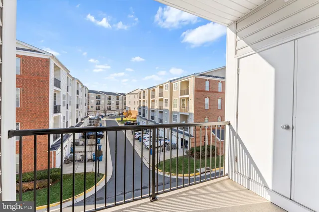 a view of staircase with a large window and wooden floor