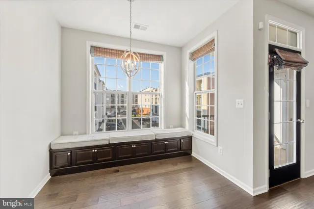 a bathroom with a tub that has a large window