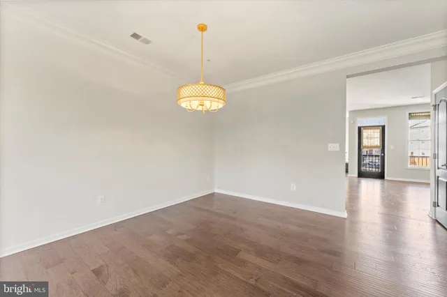 a view of a livingroom with wooden floor