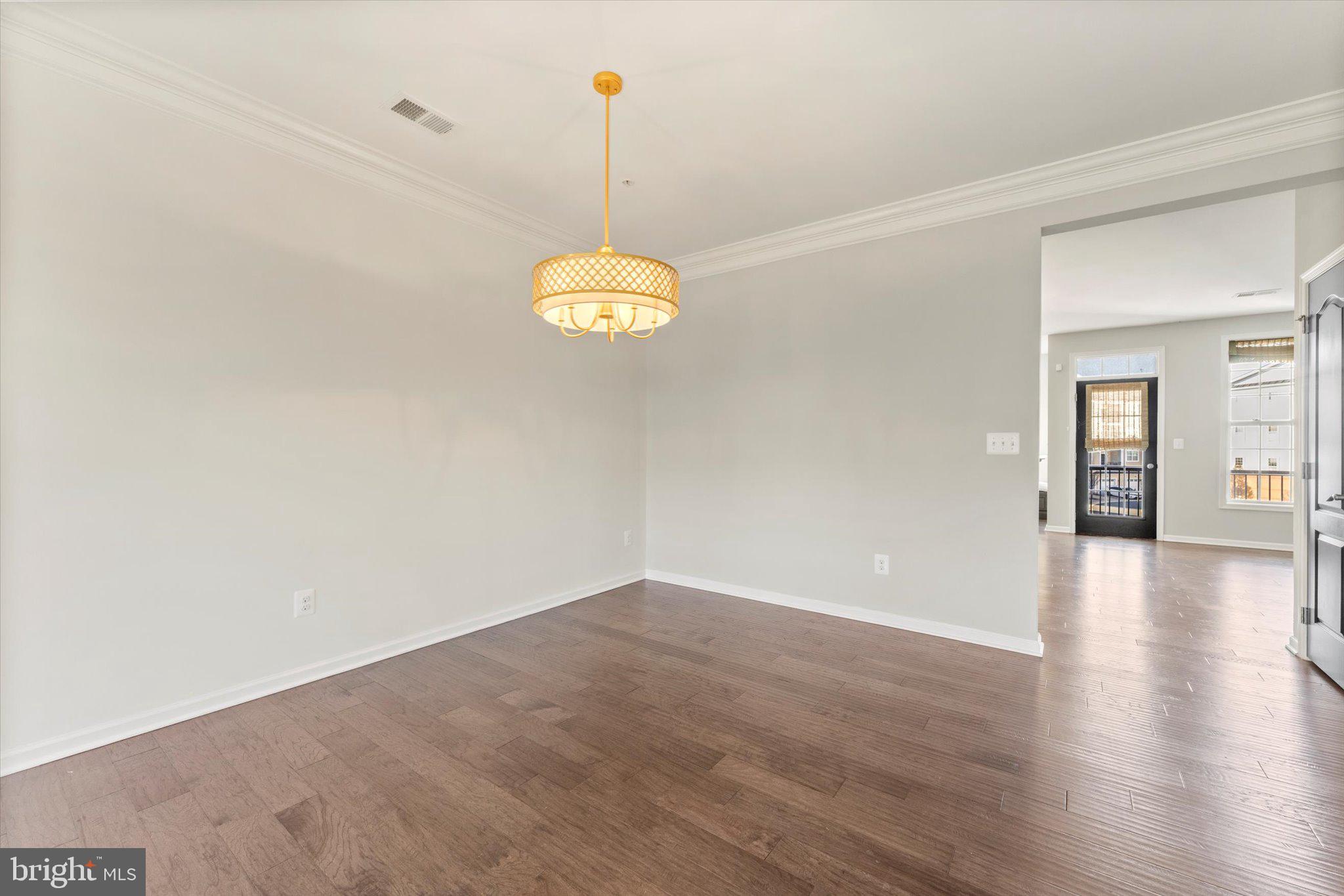 23483 Logans Ridge Terrace Ashburn, VA 20148 - Photo 17 of 35 a view of a livingroom with wooden floor