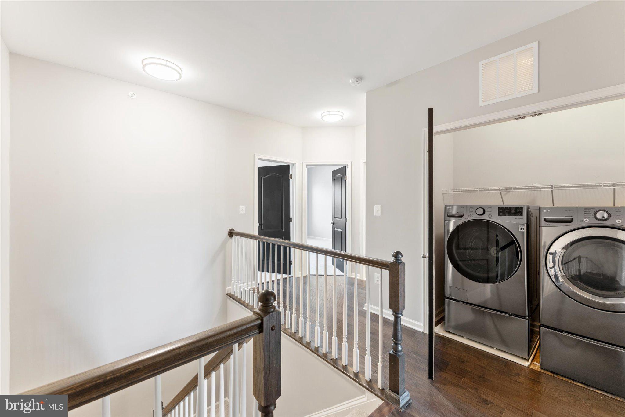 23483 Logans Ridge Terrace Ashburn, VA 20148 - Photo 19 of 35 a view of a hallway with washer and dryer