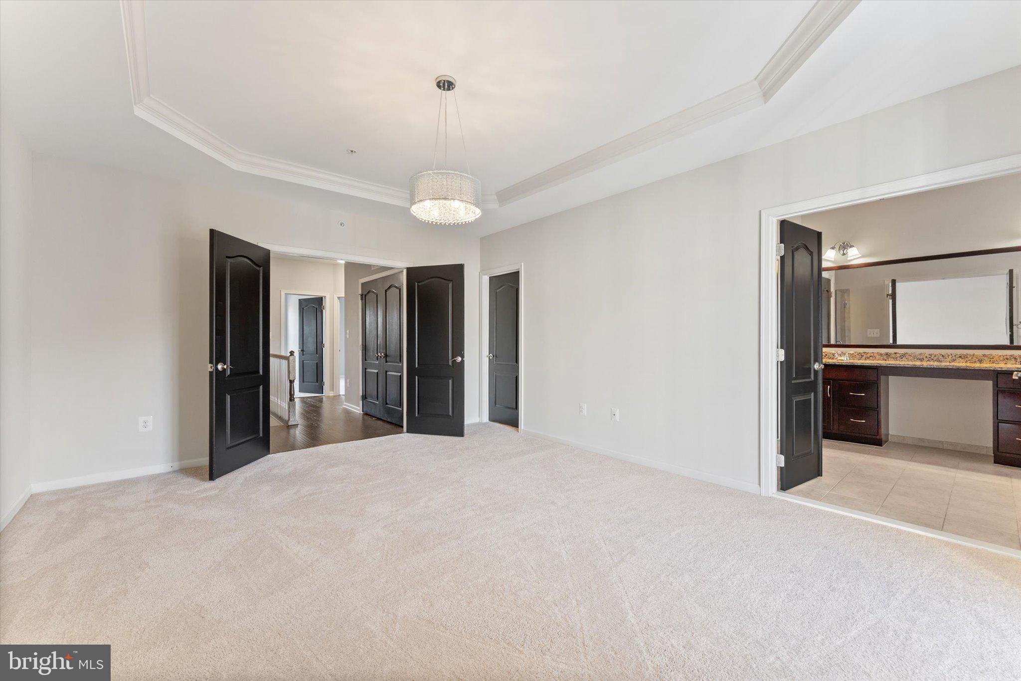 23483 Logans Ridge Terrace Ashburn, VA 20148 - Photo 22 of 35 a view of a big room with windows and chandelier