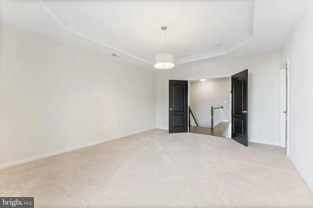 a view of a big room with closet and a bathroom