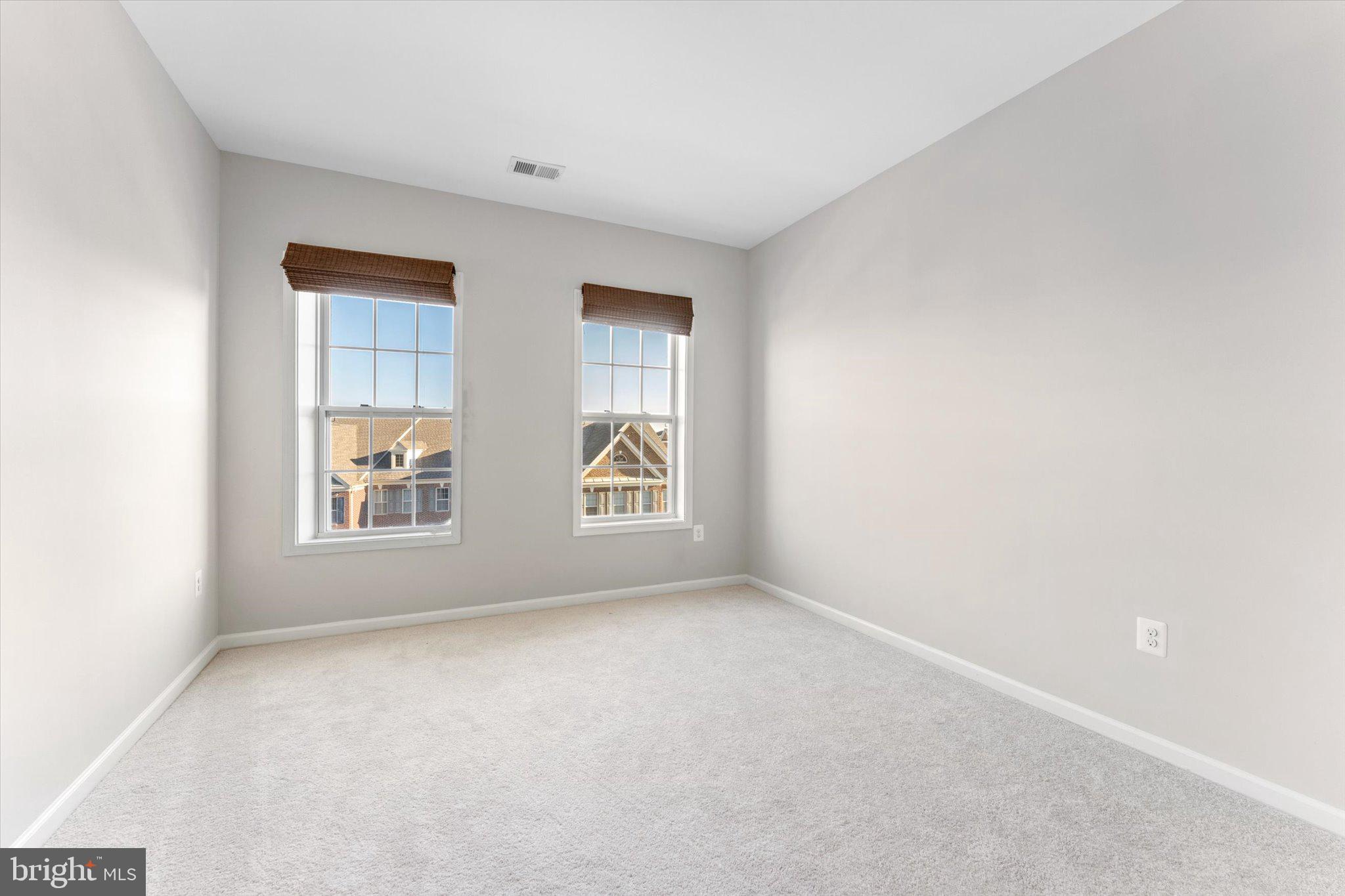 23483 Logans Ridge Terrace Ashburn, VA 20148 - Photo 31 of 35 an empty room with windows