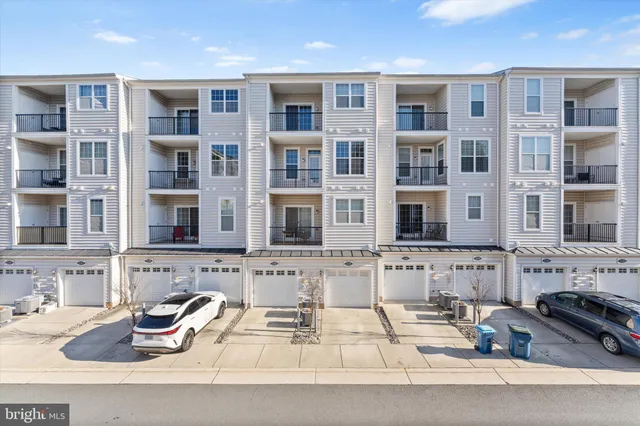a kitchen with stainless steel appliances granite countertop a stove and white cabinets