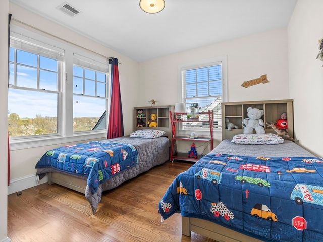 a bedroom with bed and a window