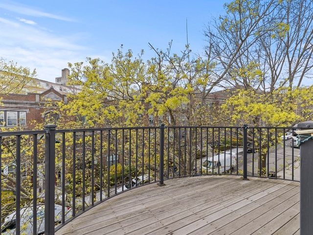 a view of a pathway with a wrought fence