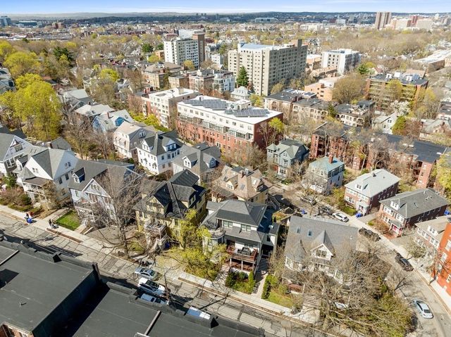 an aerial view of residential building with parking space