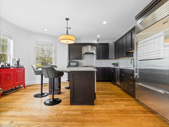 a kitchen with counter top space cabinets and appliances