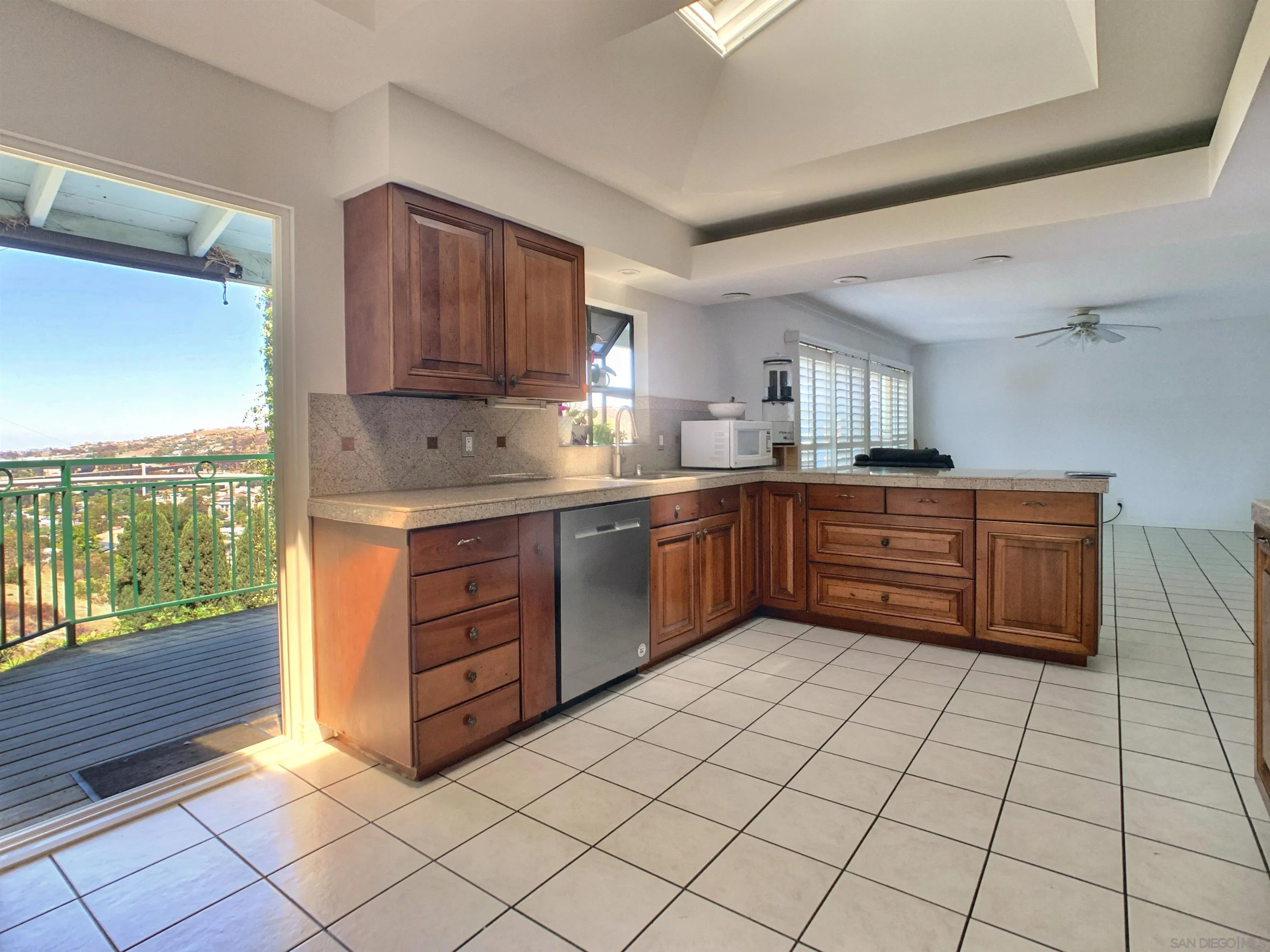 3606 Hartzel Drive Spring Valley, CA 91977 - Photo 34 of 75 Kitchen with a slider to the deck off the back of the home