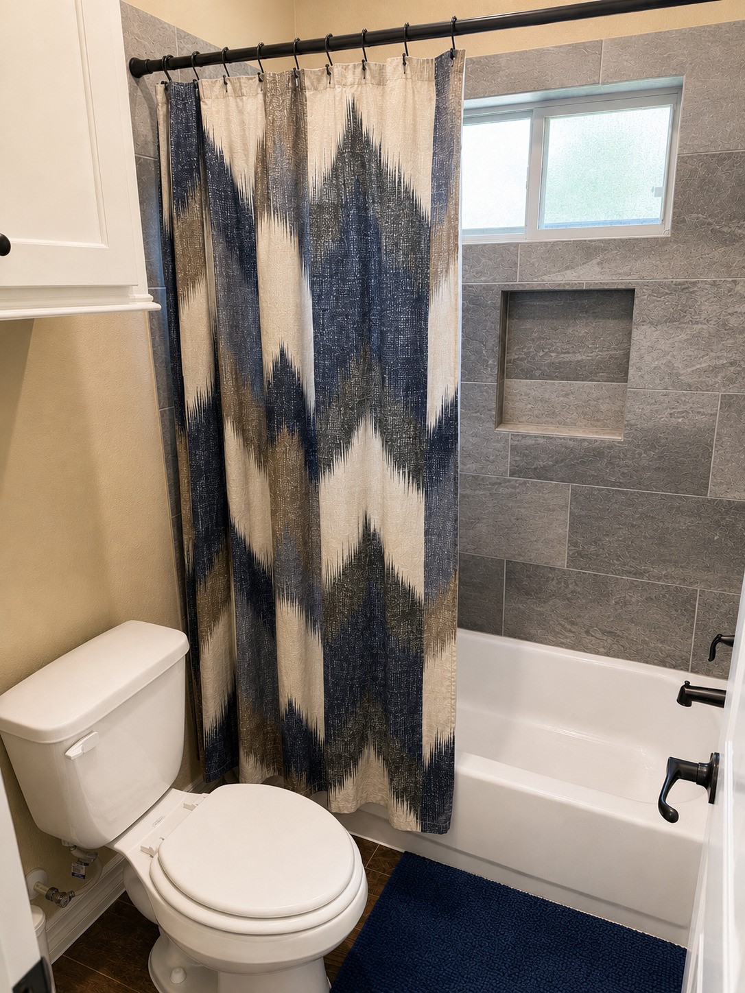 27656 Rio Blanco Drive Splendora, TX 77372 - Photo 16 of 18 Features a pristine tub-to-shower combination complete with a custom built-in toiletry niche, all beautifully wrapped in a timeless, neutral color palette.