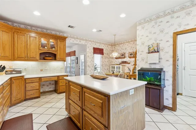 a kitchen with a sink stove and refrigerator