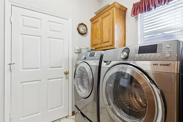 a utility room with dryer and washer