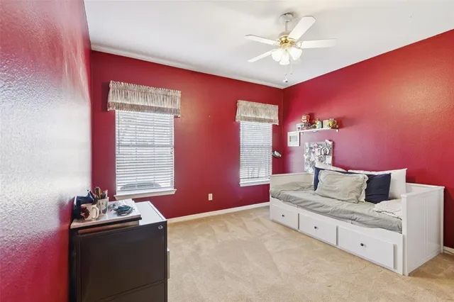 a living room with furniture and chandelier