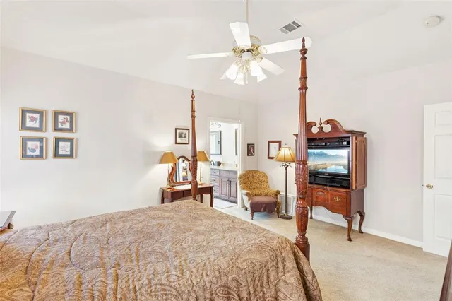a bathroom with a granite countertop sink a large mirror a and a bathtub