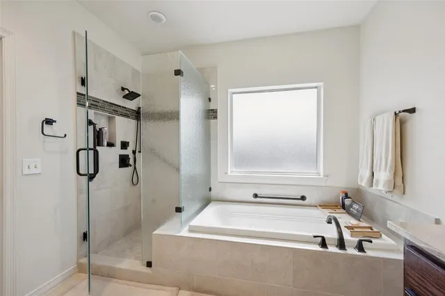 a view of a patio with table and chairs and potted plants