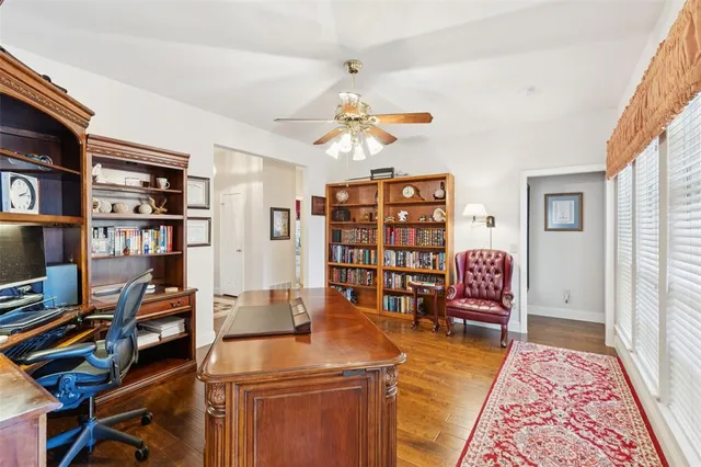 a work room with furniture and book shelf