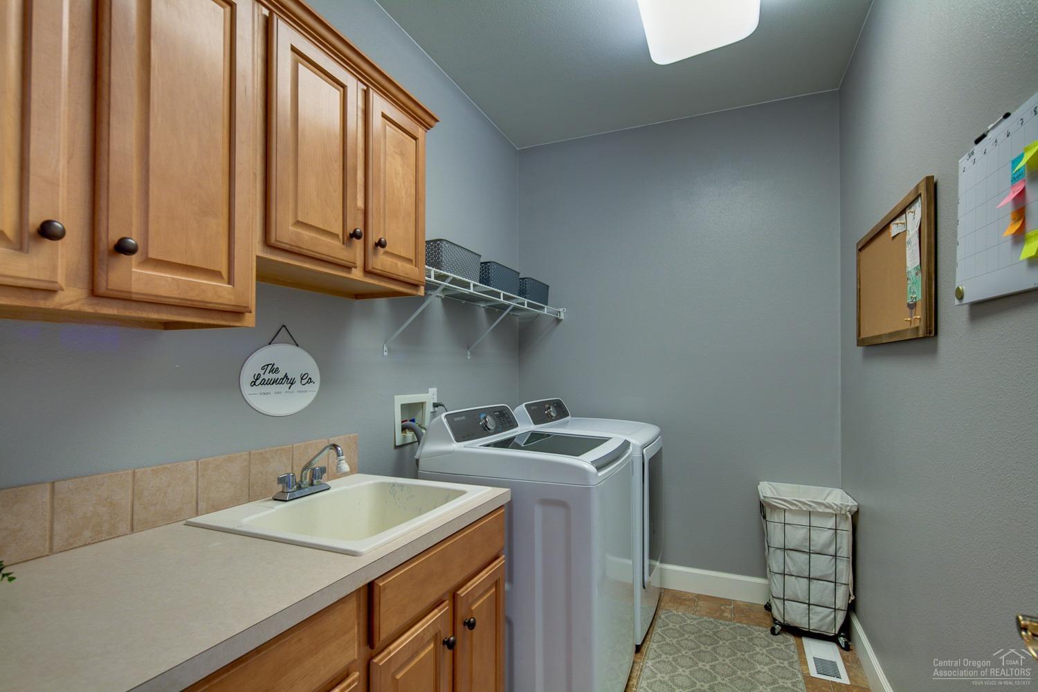 61197 Ridgewater Loop Bend, OR 97702 - Photo 19 of 25 A true utility room with a folding count