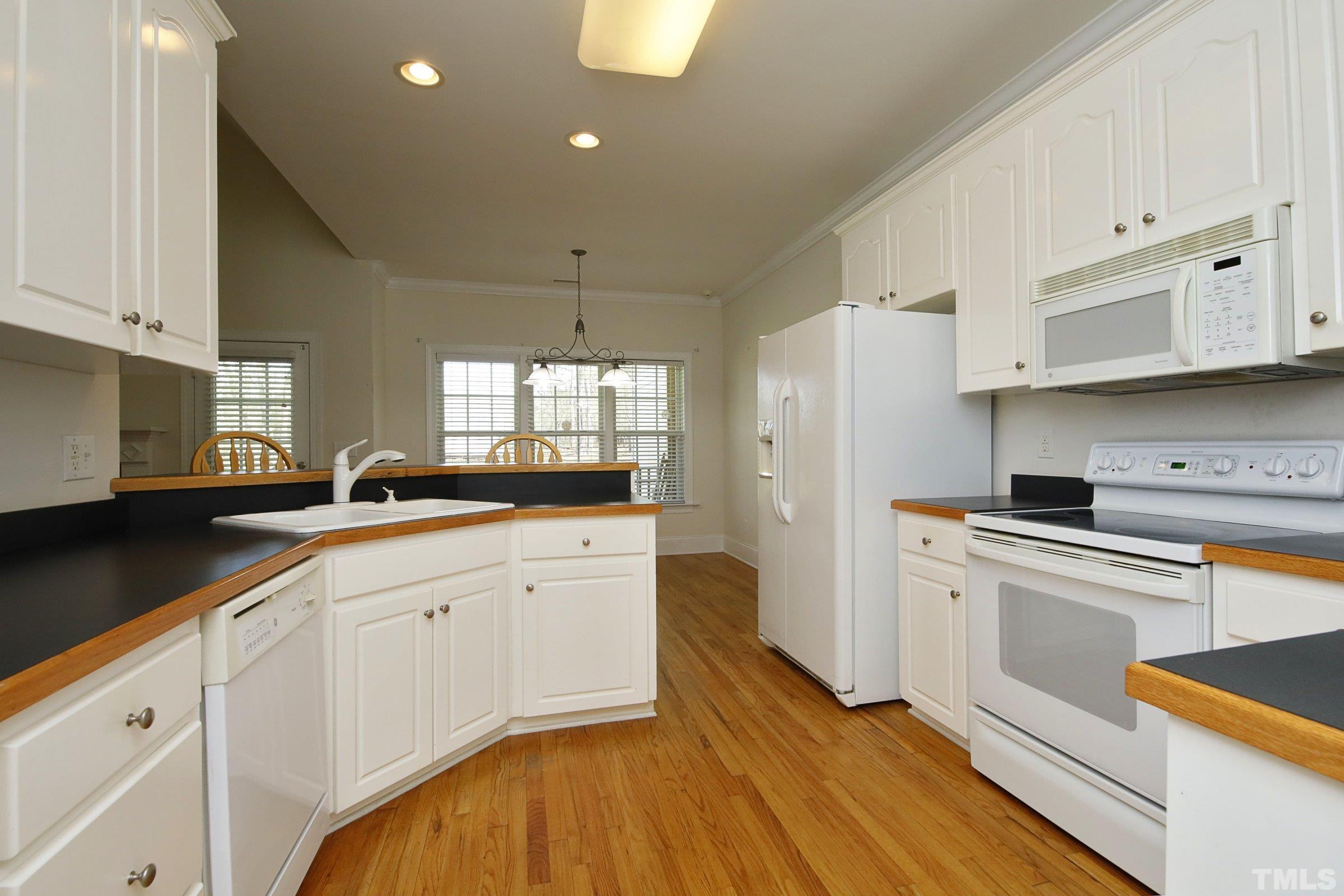 1221 Jogging Court Raleigh, NC 27603 - Photo 35 of 35 Split Floor Plan for Lots of Privacy. Wood Flooring in the Owners Suite. Access to the Covered Back Porch From the Owners Suite