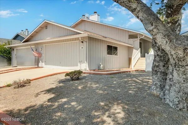 a view of a house with a yard