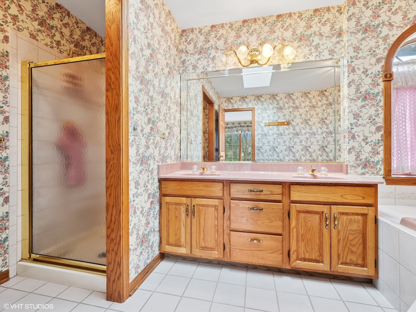 5580 Amanda Court Rolling Meadows, IL 60008 - Photo 13 of 18 a bathroom with a granite countertop sink a mirror and a shower