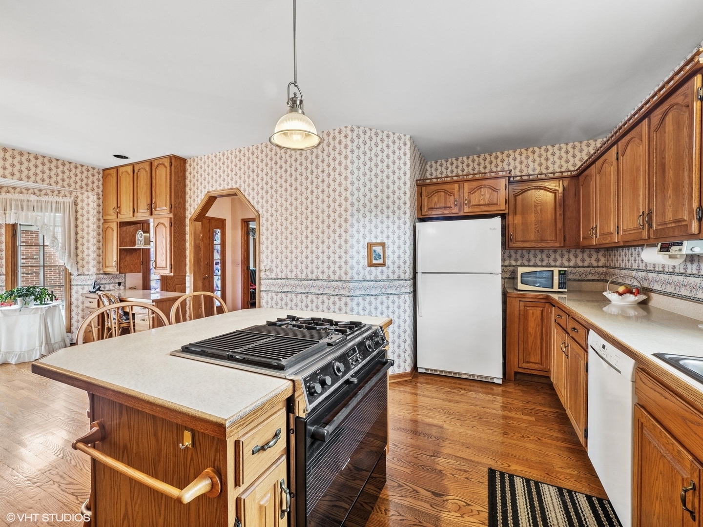 5580 Amanda Court Rolling Meadows, IL 60008 - Photo 6 of 18 a kitchen with stainless steel appliances granite countertop a stove a sink dishwasher and a refrigerator with wooden floor