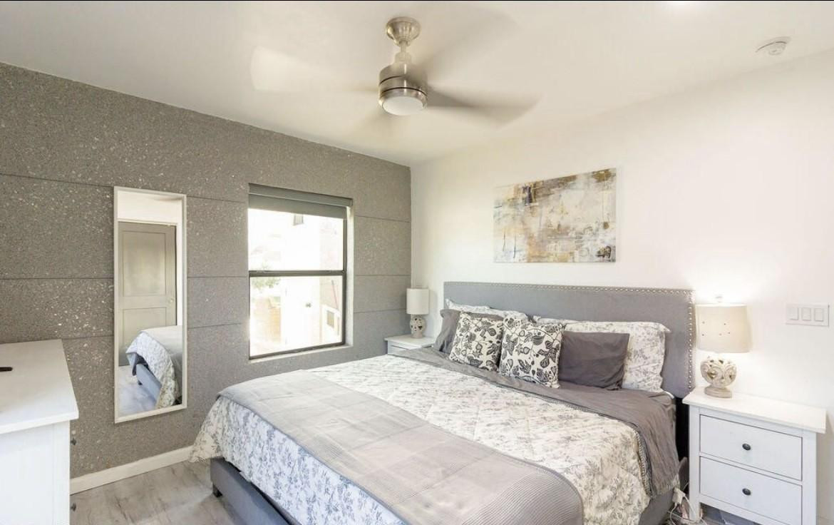 4214 North 20th Street Phoenix, AZ 85016 - Photo 19 of 40 a bedroom with a large bed and a window