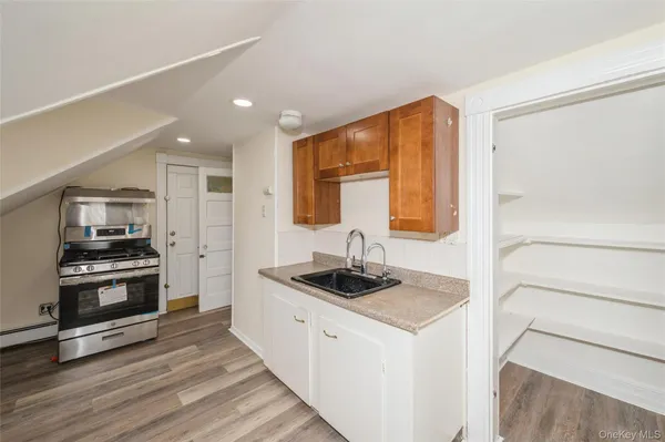 a kitchen with stainless steel appliances granite countertop a stove and a refrigerator