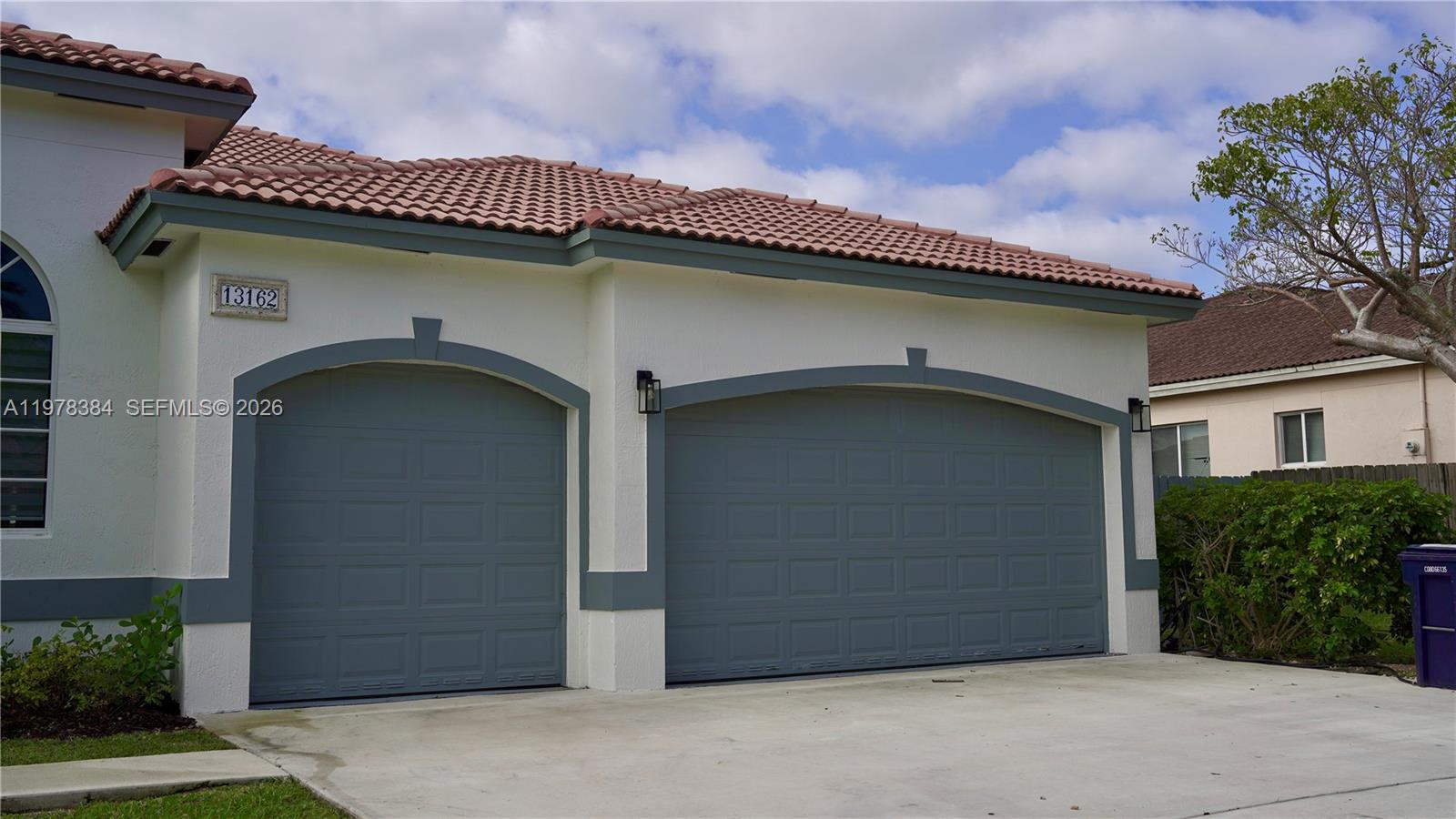 13162 Southwest 191st Terrace, Unit 1 Miami, FL 33177 - Photo 1 of 7 a front view of a house