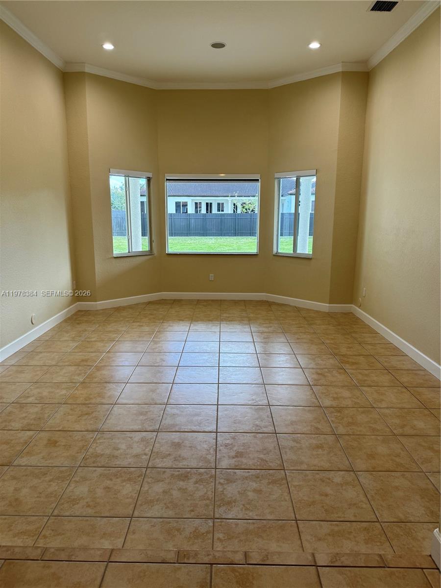 13162 Southwest 191st Terrace, Unit 1 Miami, FL 33177 - Photo 4 of 7 a view of a livingroom with an entryway and a window